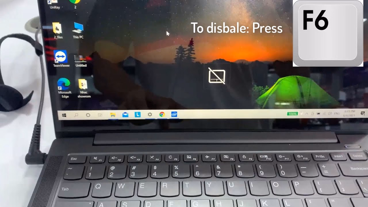 How do I re-enable the touchpad on my Lenovo laptop?