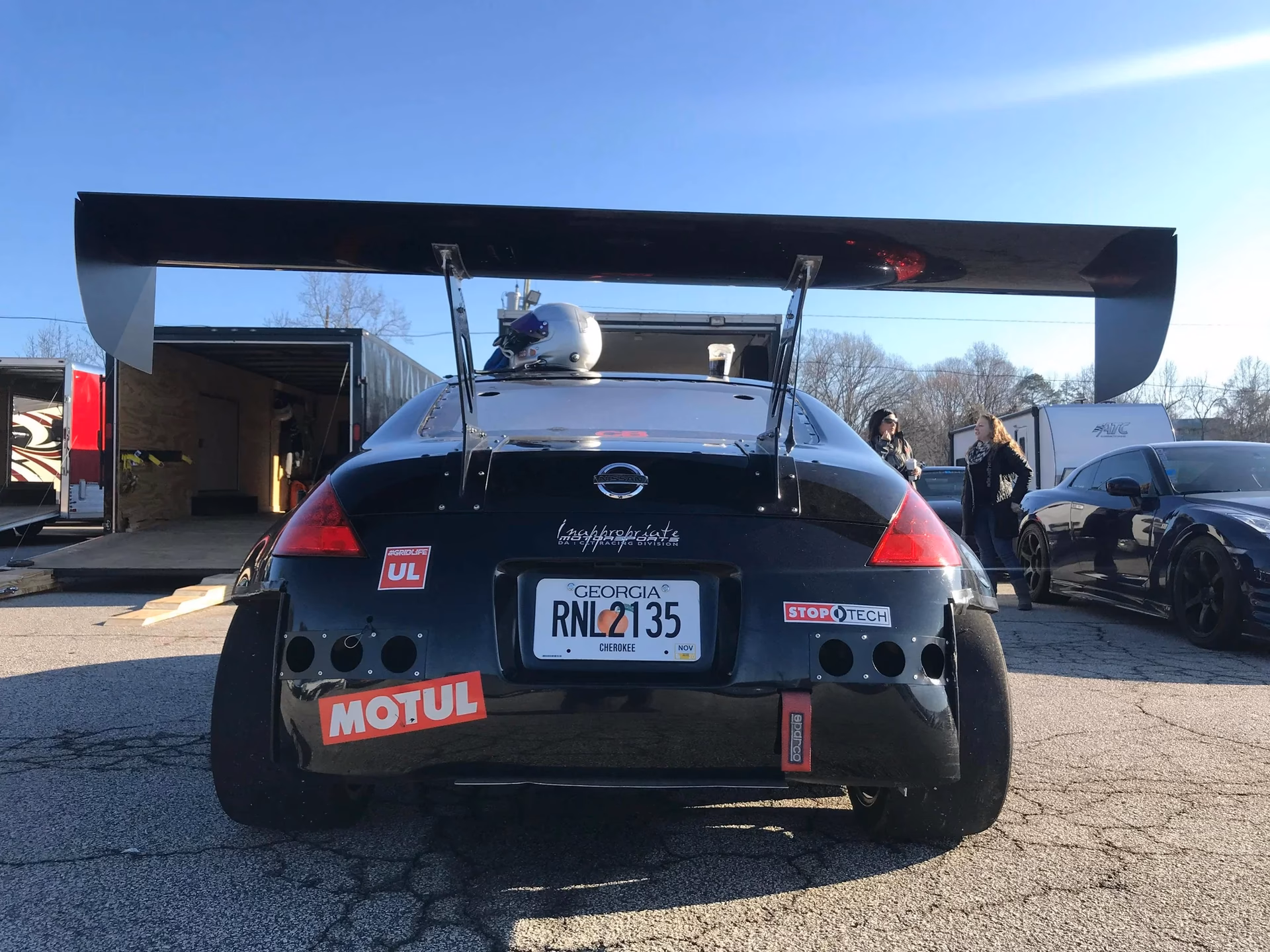 How much does the rear spoiler extend?
