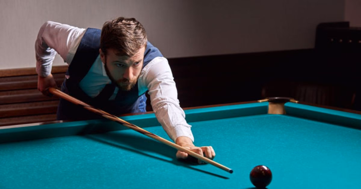 How do you hold a pool stick?