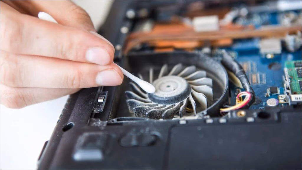 How do you cool down an overheating laptop?