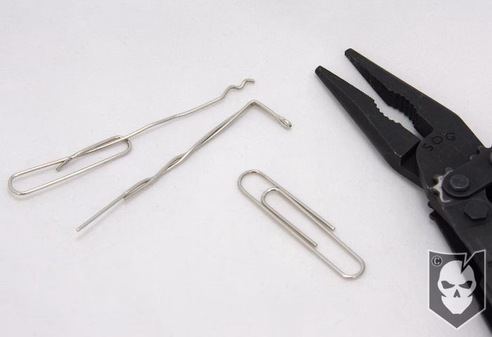 How do you pick a lock with paper clips?
