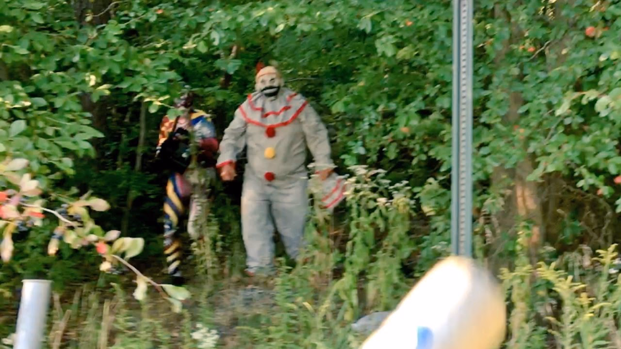 What happens in clowns in the woods?
