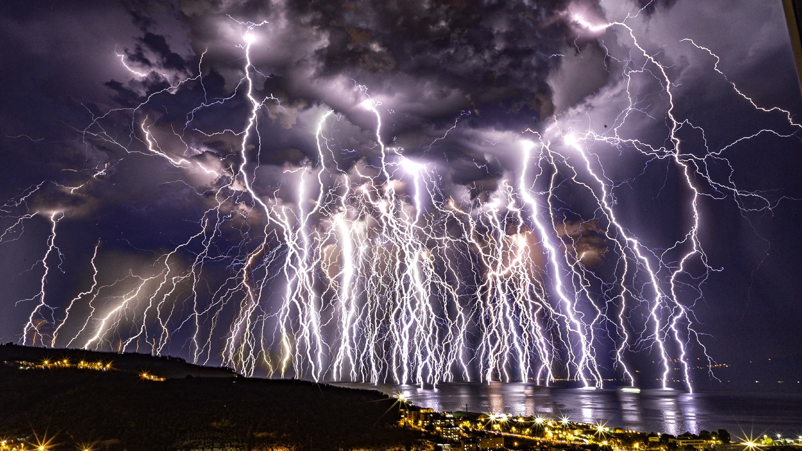 What causes lightning in a thunderstorm?