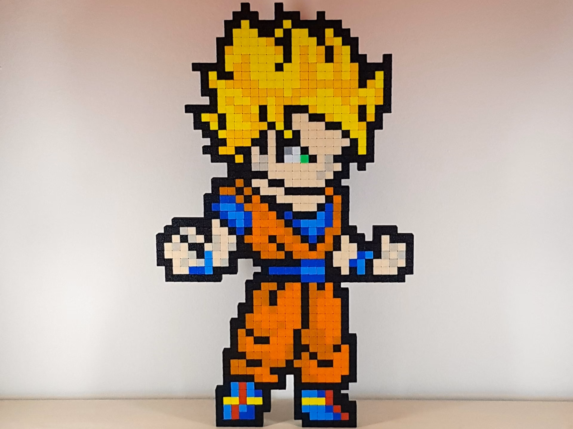 ¿Dónde puedo encontrar ideas sobre pixel art de Goku?