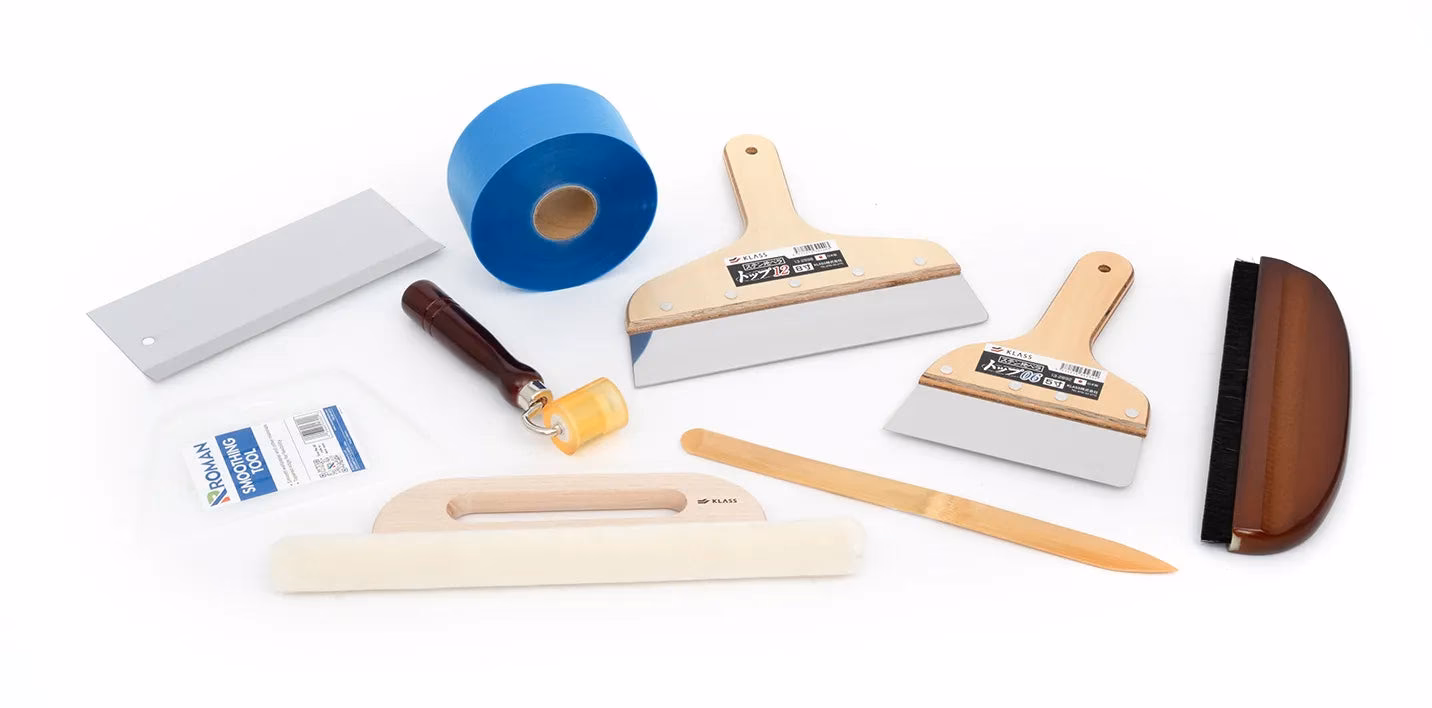 What are the different types of wallpapering tools?