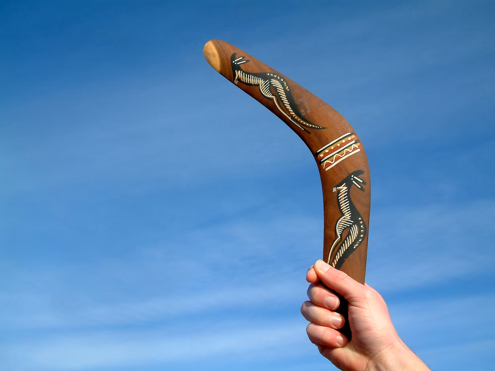 Why do boomerangs come back to the person who threw them?
